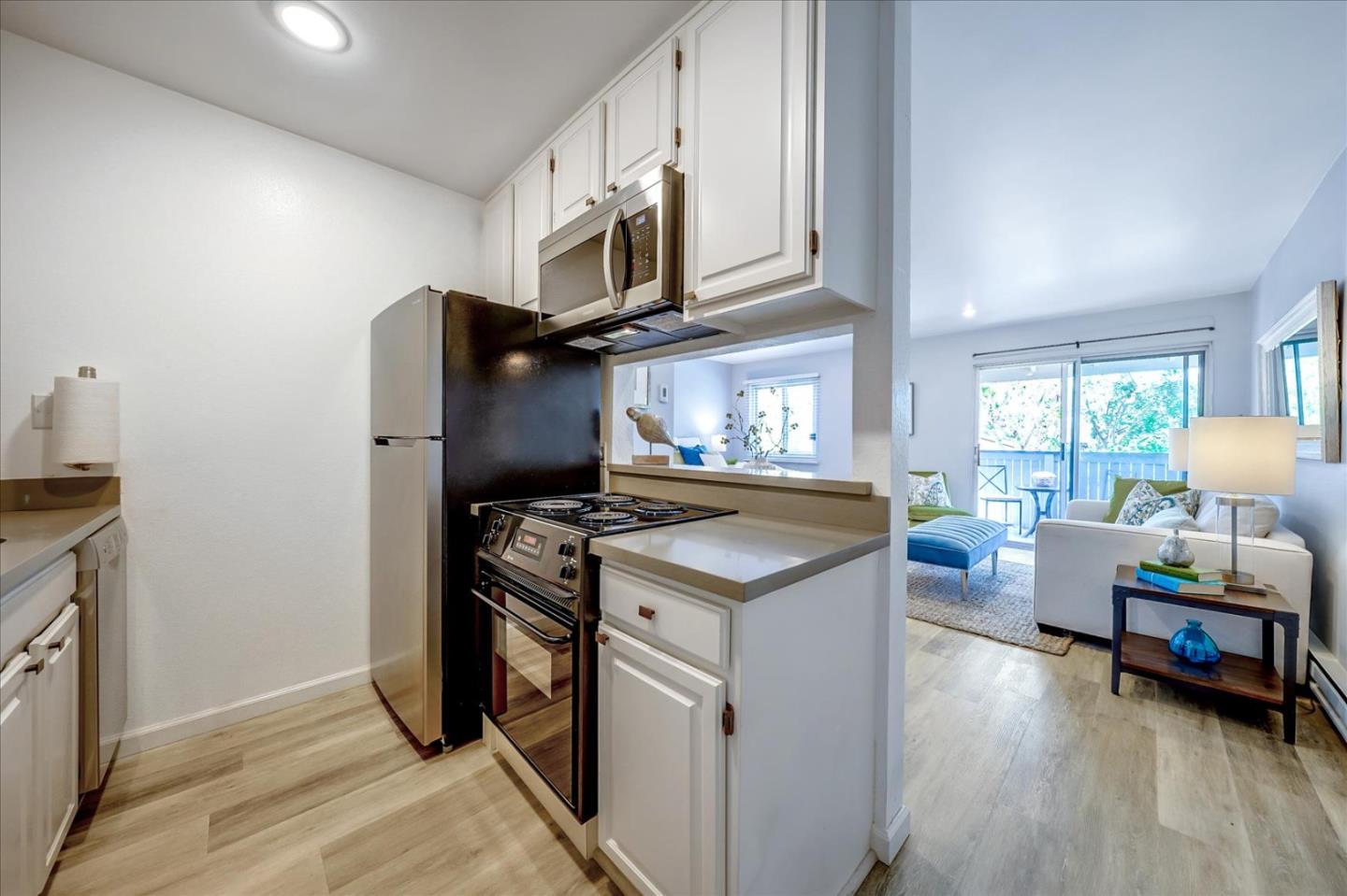 1126 Cherry Avenue, Unit 16 San Bruno, CA 94066 - Photo 6 of 32 a kitchen with a stove and a refrigerator