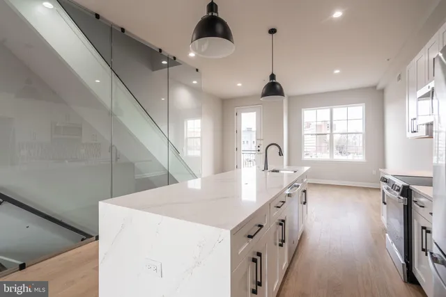 a kitchen with sink cabinets and window