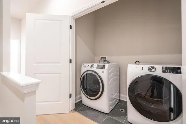 a utility room with dryer and washer