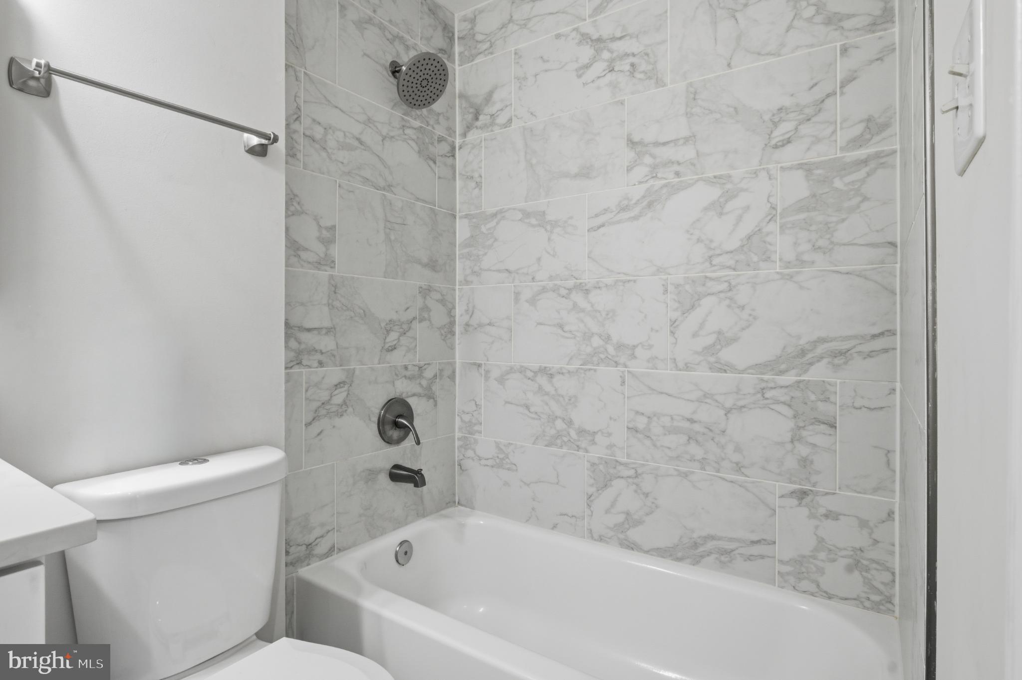 2917 Seminole Road Woodbridge, VA 22192 - Photo 12 of 44 Sleek marble bath for modern living.