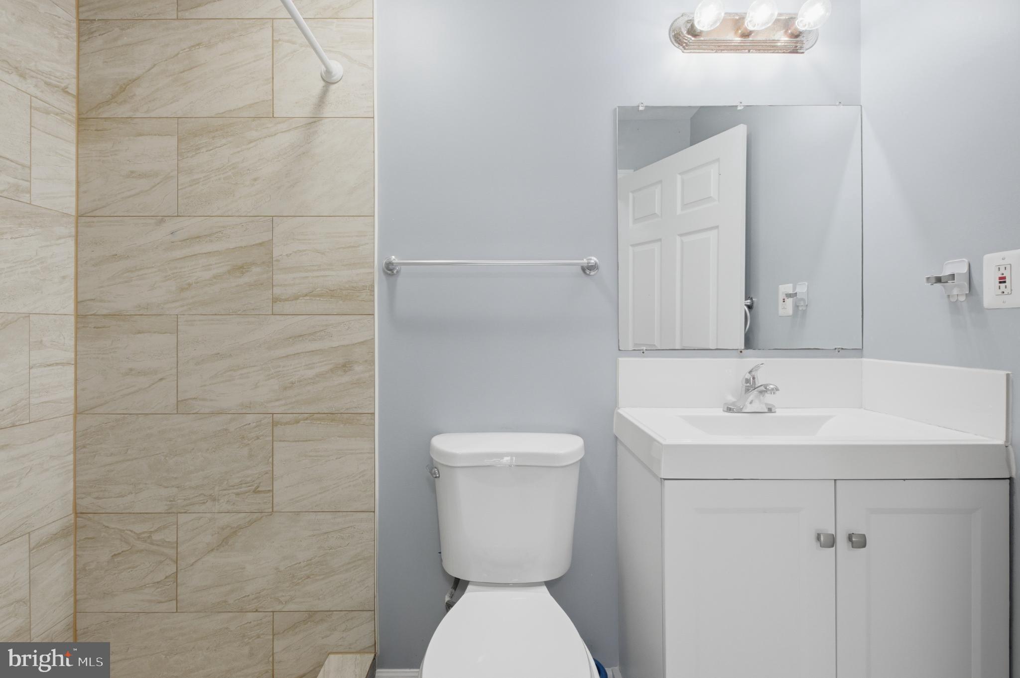 2917 Seminole Road Woodbridge, VA 22192 - Photo 20 of 44 Modern bathroom with elegant tile accents.