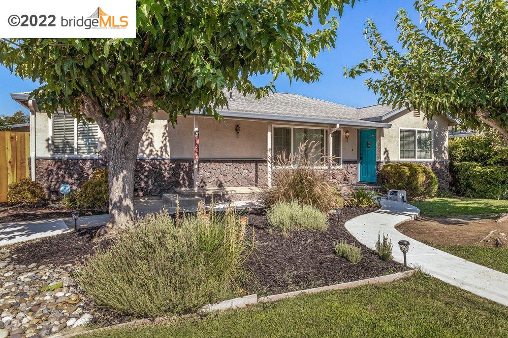 1573 Ayers Road Concord, CA 94521 - Photo 1 of 1 a view of a house with backyard sitting area and garden
