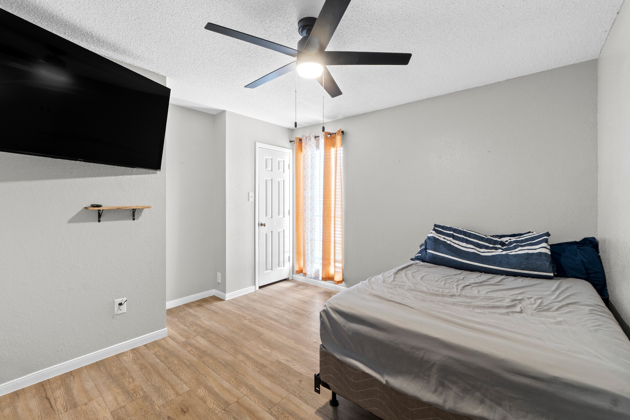 205 Sedro Trail Georgetown, TX 78633 - Photo 23 of 32 A well-proportioned bedroom with resilient flooring, illuminated by a contemporary ceiling fan and abundant natural light.