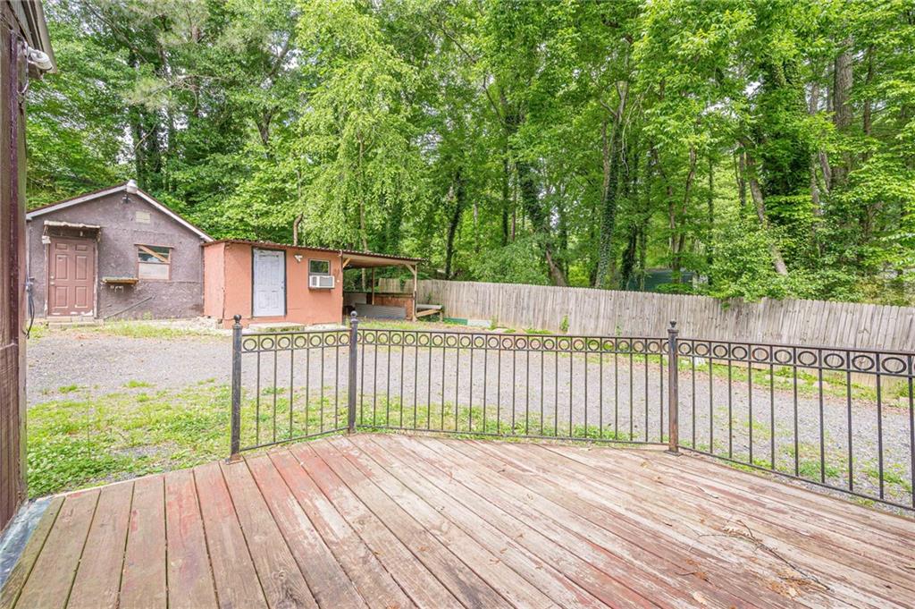 90 Valley Trail Southeast Acworth, GA 30101 - Photo 22 of 28 a view of a wooden deck next to a yard