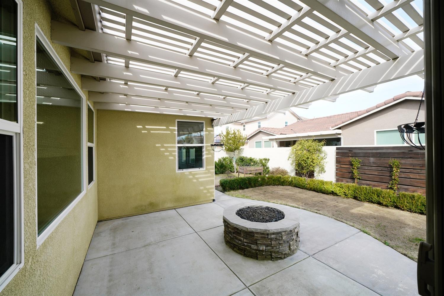 3563 Journey Way Clovis, CA 93619 - Photo 14 of 20 a view of a patio with table and chairs and potted plants