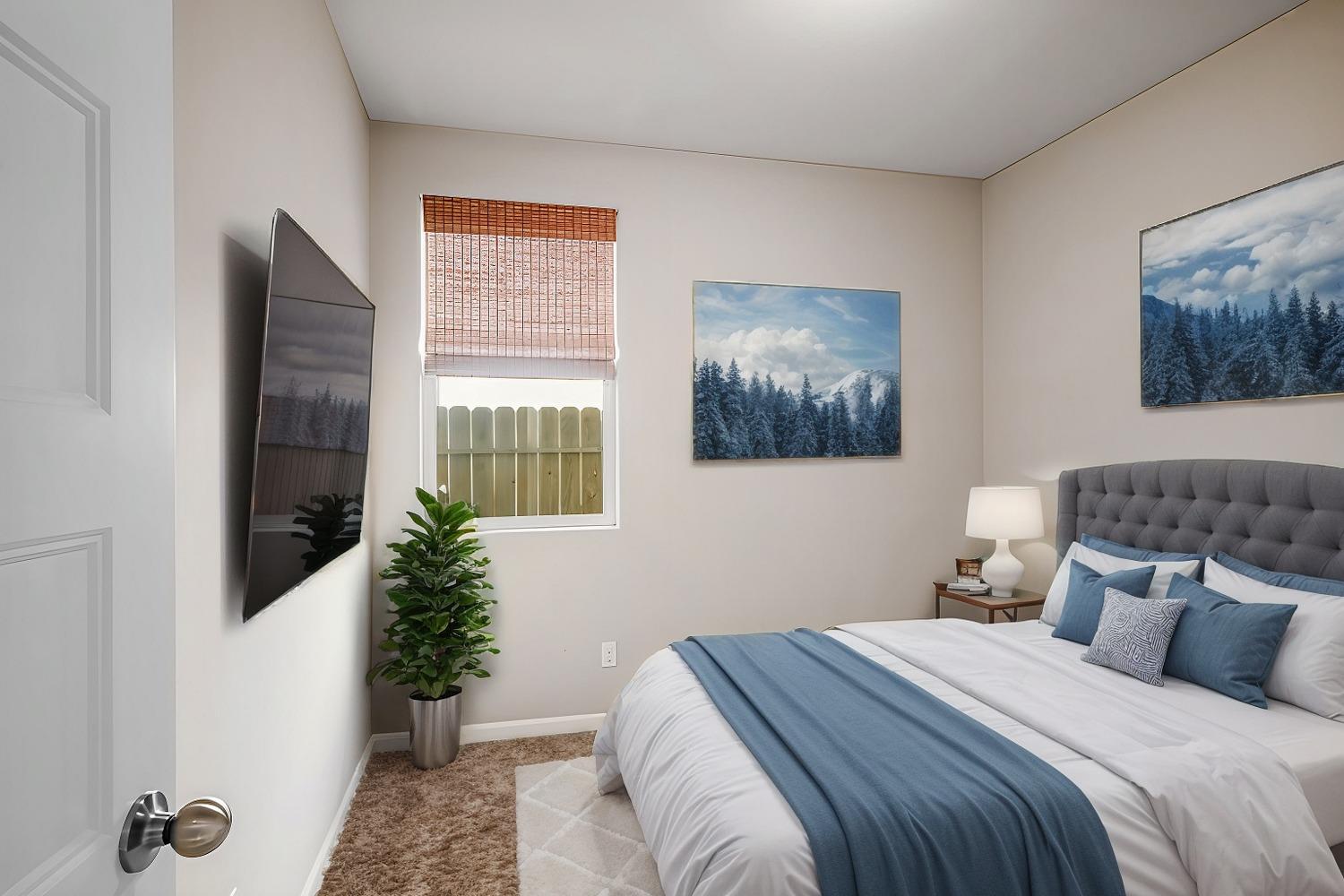 3563 Journey Way Clovis, CA 93619 - Photo 5 of 20 a bedroom with a bed and a painting on the wall