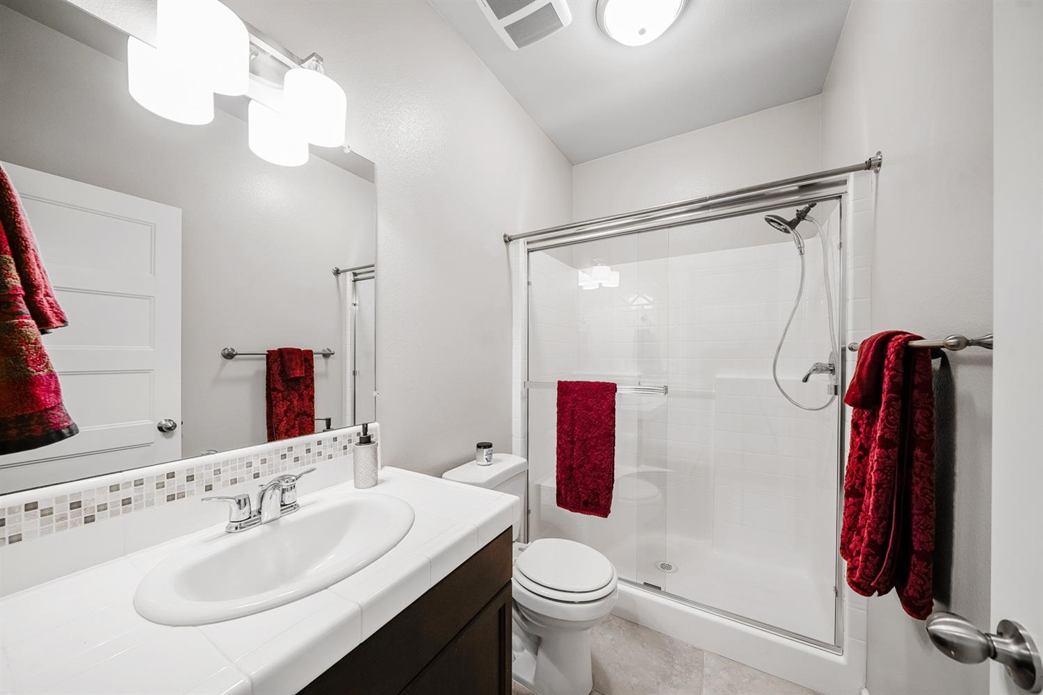 3563 Journey Way Clovis, CA 93619 - Photo 8 of 20 a bathroom with a sink vanity mirror and toilet