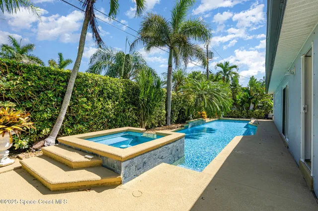 a view of a backyard with chairs