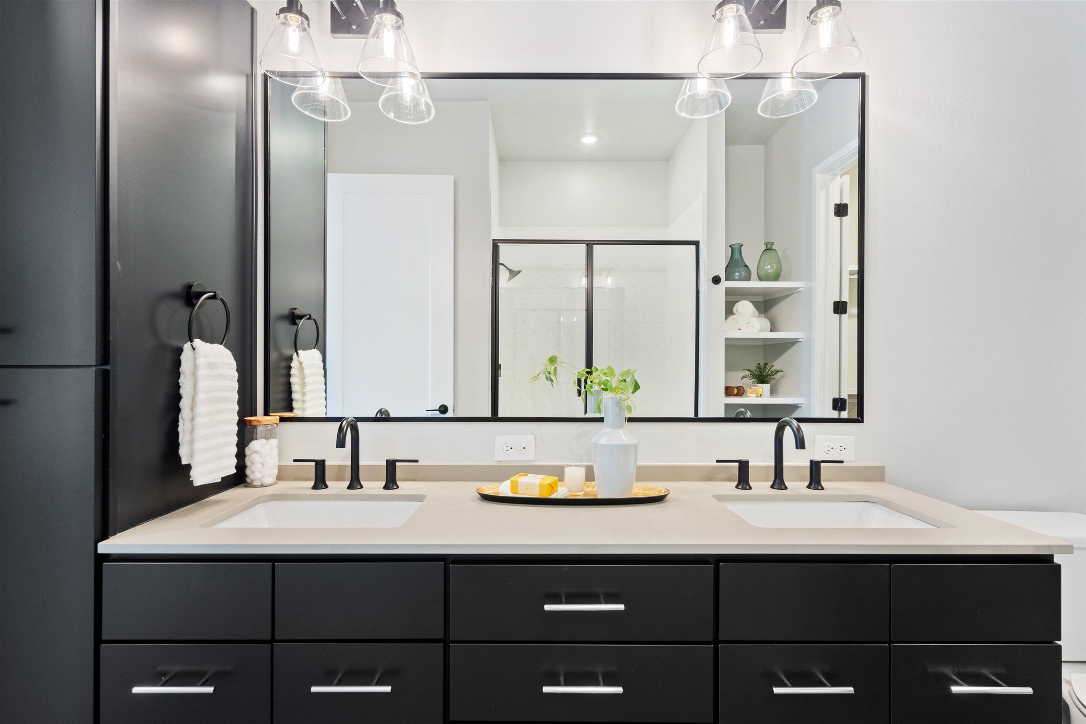4510 Terry-O Lane, Unit 341 Austin, TX 78745 - Photo 32 of 40 Bathroom featuring a dual vanity with black cabinetry, light-colored countertops, and two rectangular sinks
