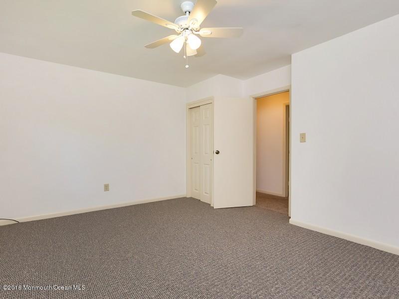 792 Hulses Corner Road Howell, NJ 07731 - Photo 25 of 43 an empty room with a ceiling fan and a window