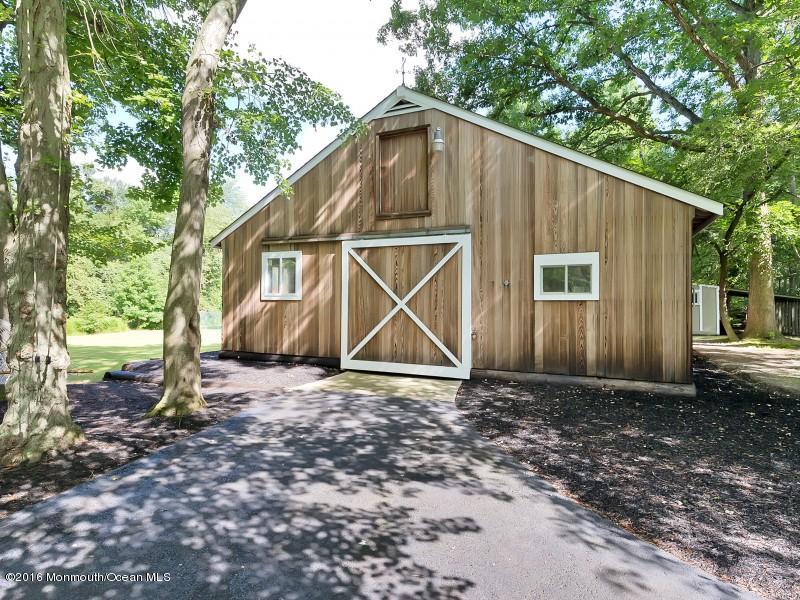 792 Hulses Corner Road Howell, NJ 07731 - Photo 27 of 43 a view of wooden house with large trees and wooden fence