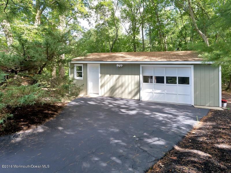 792 Hulses Corner Road Howell, NJ 07731 - Photo 36 of 43 a front view of a house with a yard and garage