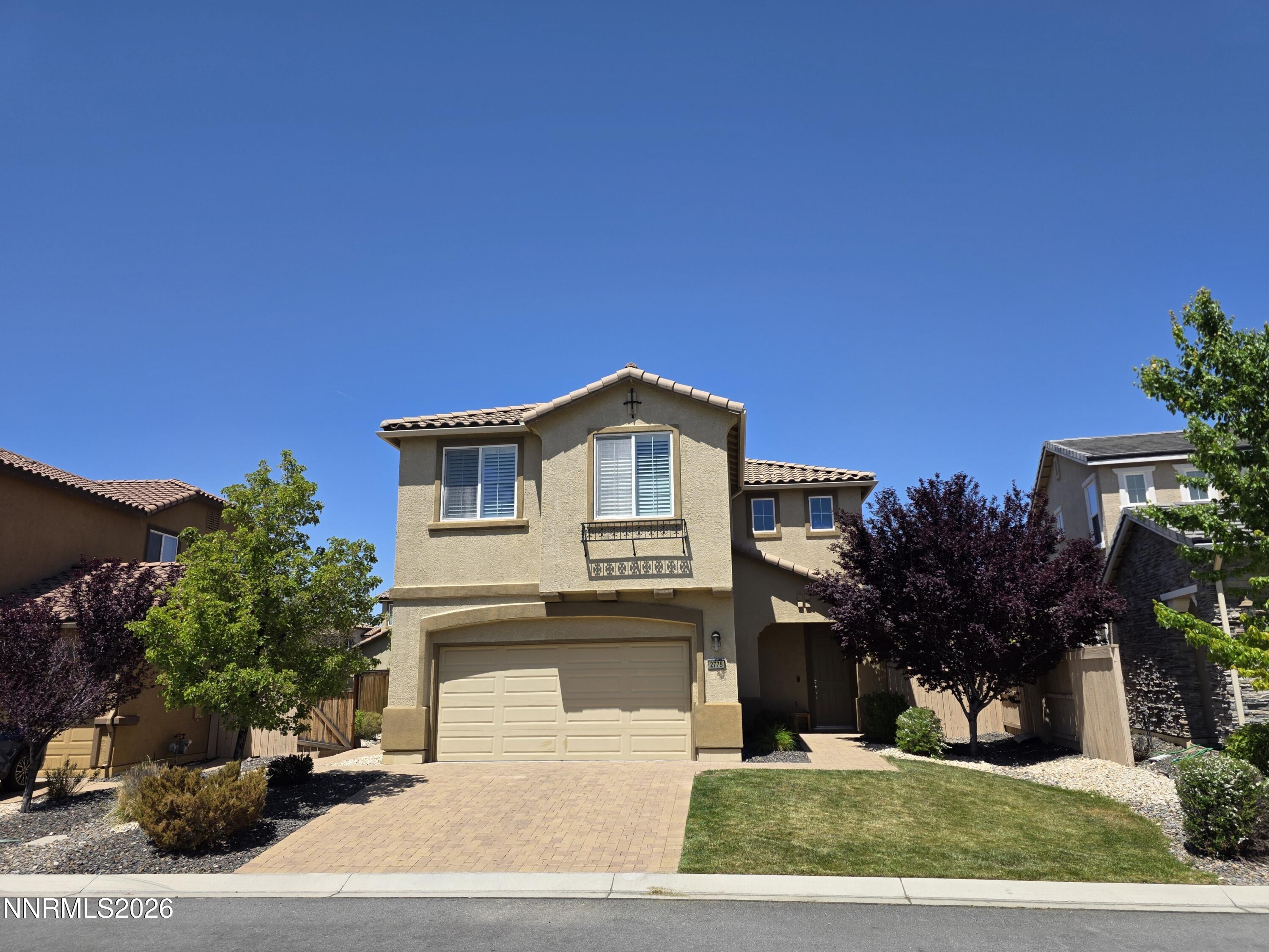 2775 Bonfire Lane Reno, NV 89521 - Photo 1 of 41 a front view of a house with a yard