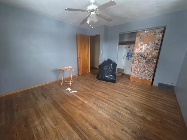 a room with furniture and wooden floor