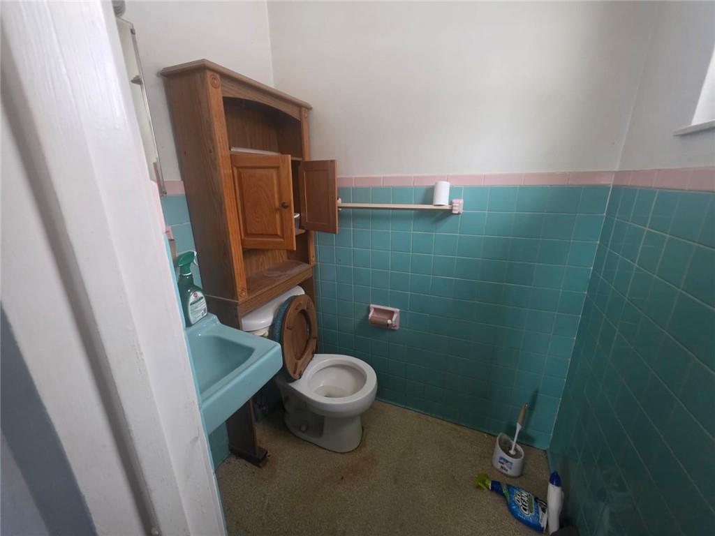 429 Paris Colliers Road Burgettstown, PA 15021 - Photo 13 of 25 a bathroom with a granite countertop toilet and a sink