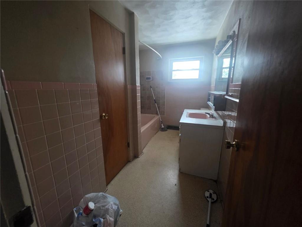 429 Paris Colliers Road Burgettstown, PA 15021 - Photo 14 of 25 a bathroom with a sink a toilet and mirror