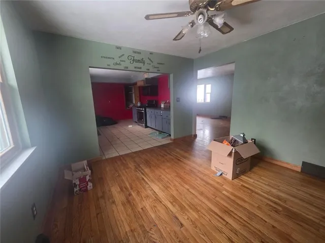 a very nice looking room with a wooden floor and chandelier