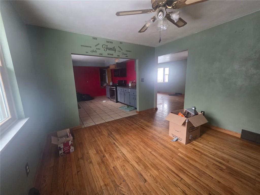 429 Paris Colliers Road Burgettstown, PA 15021 - Photo 8 of 25 a very nice looking room with a wooden floor and chandelier