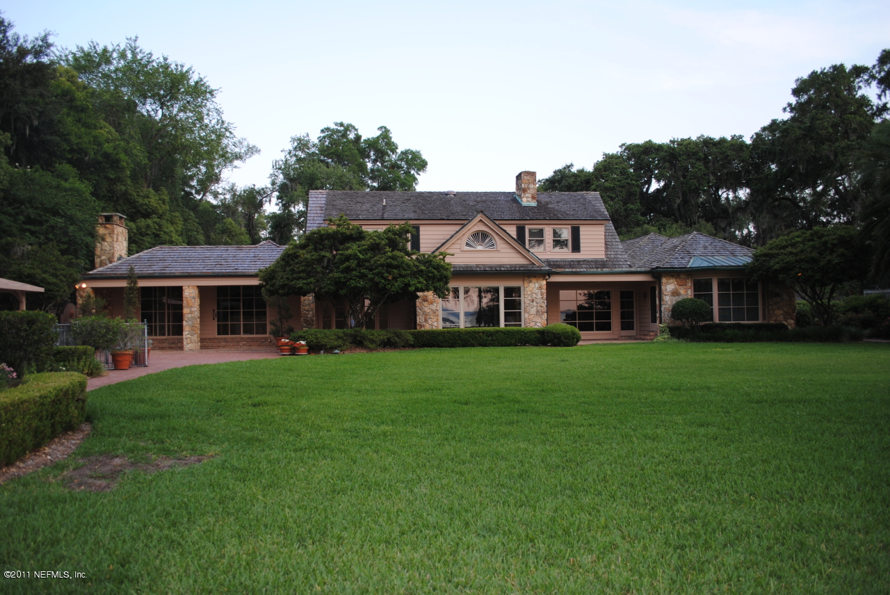 12316 Mandarin Road Jacksonville, FL 32223 - Photo 31 of 40 a front view of a house with a garden