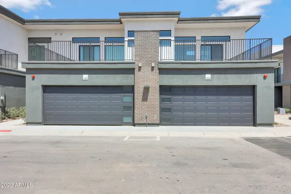 a front view of house with garage