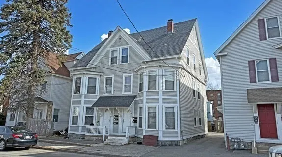 a view of a white building among the street