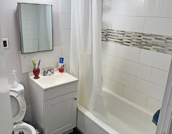 a bathroom with a sink toilet and tub