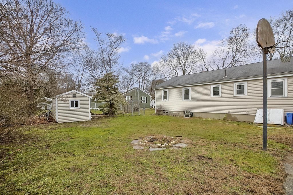 49 Sullivan Road Stoughton, MA 02072 - Photo 21 of 26 a front view of a house with garden
