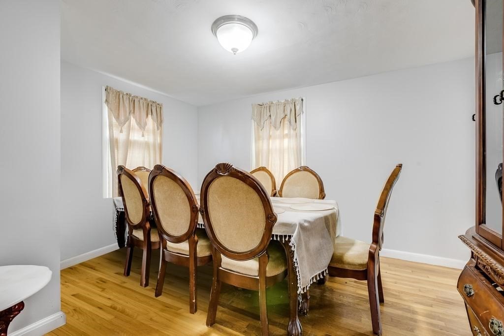 49 Sullivan Road Stoughton, MA 02072 - Photo 8 of 26 a view of a dining room with furniture window and wooden floor