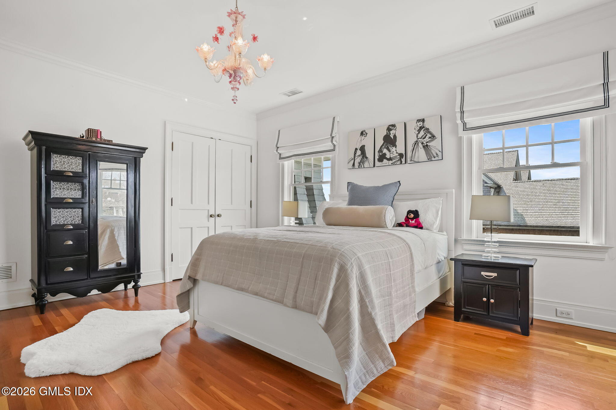 200 Shore Road Old Greenwich, CT 06870 - Photo 18 of 34 a spacious bedroom with a bed and window