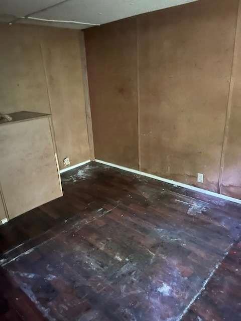 2088 Wiley Street Thomaston, GA 30286 - Photo 5 of 7 a view of an empty room with wooden floor