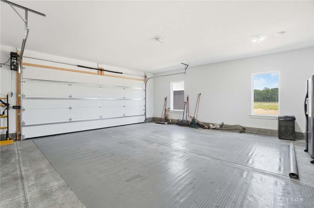 9364 Kenrick Road Dayton, OH 45458 - Photo 41 of 62 This spacious garage offers ample storage and direct access, perfect for vehicles and projects alike.