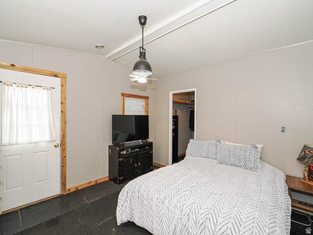 94 Spring Canyon Road Coalville, UT 84017 - Photo 40 of 50 Neutral-toned walls complement the dark flooring in this room