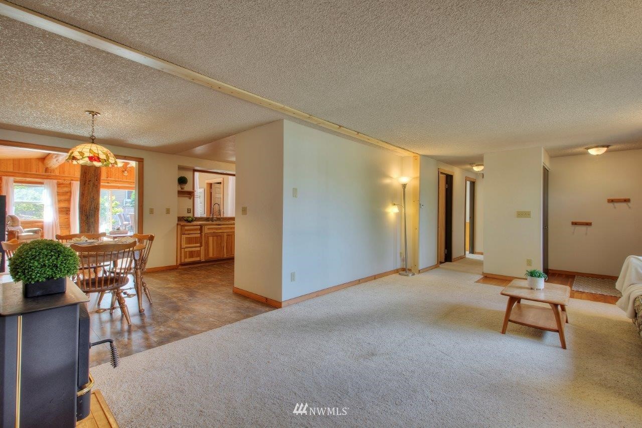 2138 Union Avenue Northeast Renton, WA 98059 - Photo 18 of 23 a view of a livingroom with furniture and a kitchen