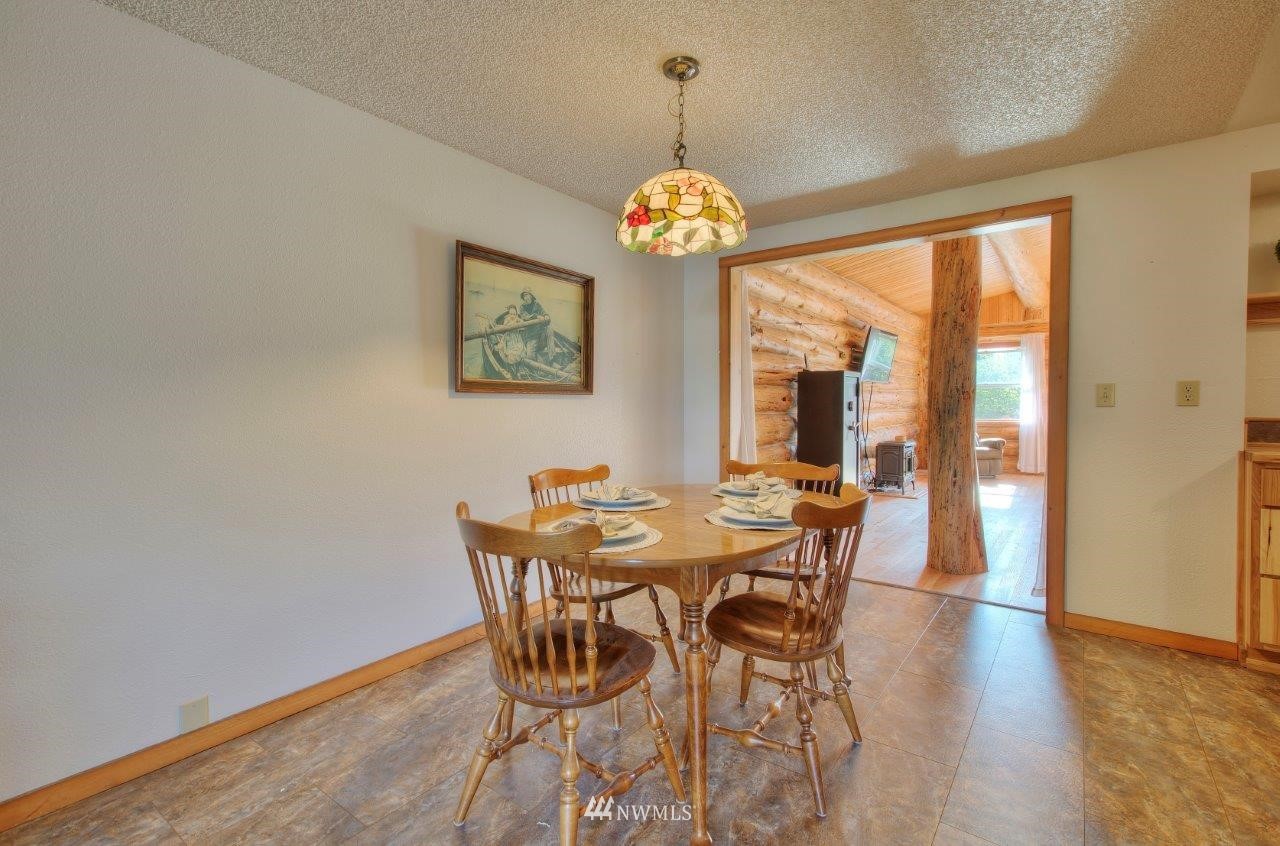 2138 Union Avenue Northeast Renton, WA 98059 - Photo 5 of 23 a view of a dining room with furniture wooden floor and chandelier