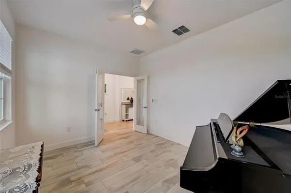a view of an entryway with paintings on the wall