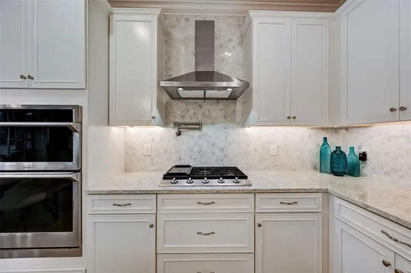 a living room with furniture a flat screen tv and a window
