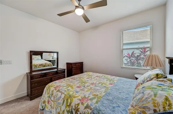 a view of a balcony with chairs and wooden floor