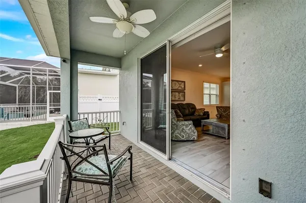 an aerial view of a house with swimming pool outdoor seating and yard