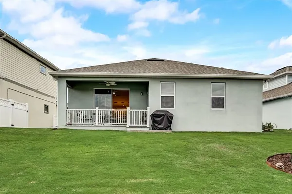 a front view of a house with yard and porch
