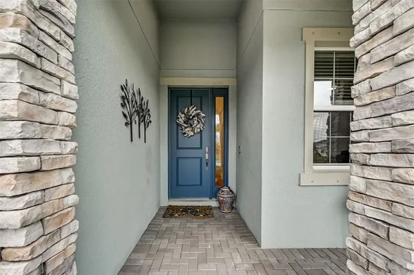 a view of a room with wooden floor and furniture