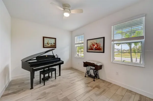 a view of an empty room and wooden floor
