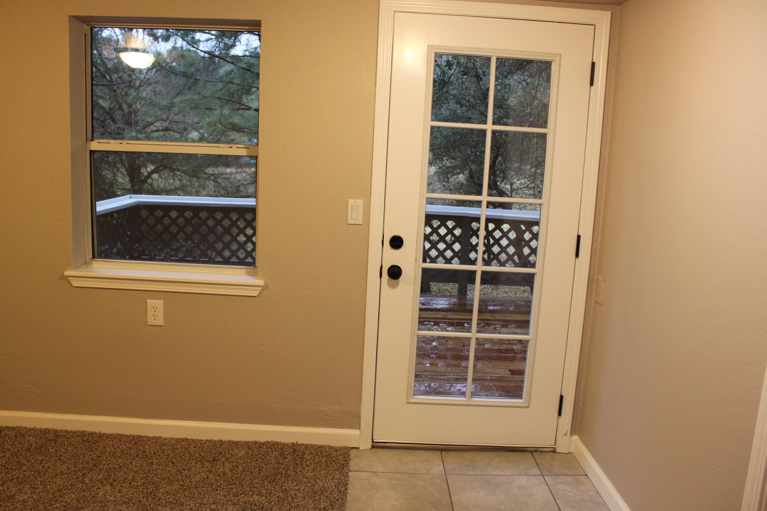 22158 Sunshine Way Redding, CA 96003 - Photo 17 of 29 Bedroom 3 door to back patio