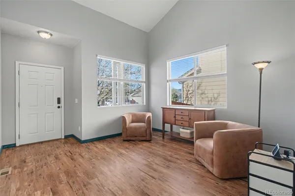 a bedroom with furniture and windows