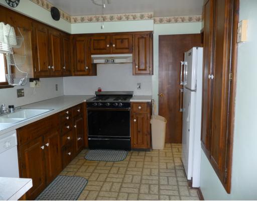 10440 Five Points Road Home, PA 15747 - Photo 4 of 12 Kitchen. Kitchen includes all appliances and a large pantry cupboard. Double bowl sink has garbage disposal and hot water dispenser. Swinging doors lead to dining room.