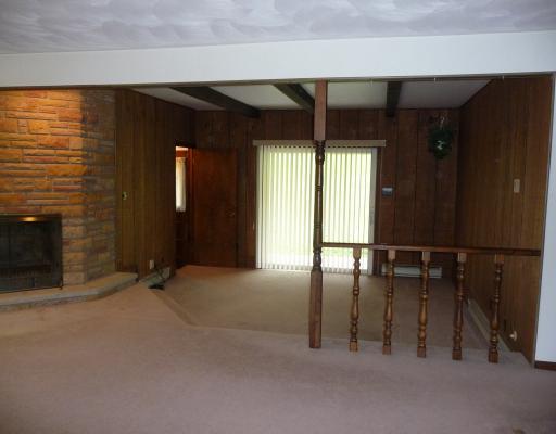 10440 Five Points Road Home, PA 15747 - Photo 6 of 12 Den/Family/Great Room. Sunken family room is off of living room and has paneled walls and beamed ceiling. Sliding doors lead to covered patio.