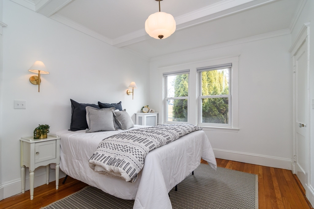 32 Harvard Street Natick, MA 01760 - Photo 13 of 24 a bedroom with bed and window