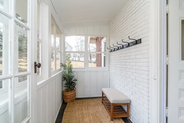 a bathroom with a sink and wooden floor