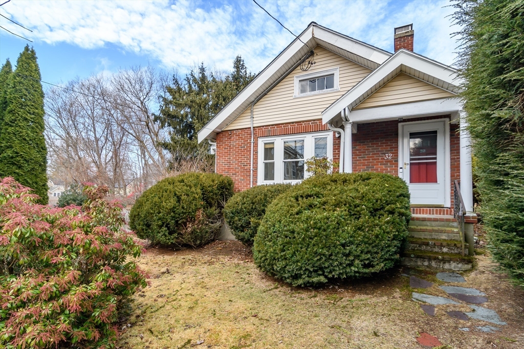 32 Harvard Street Natick, MA 01760 - Photo 2 of 24 a view of a backyard with plants