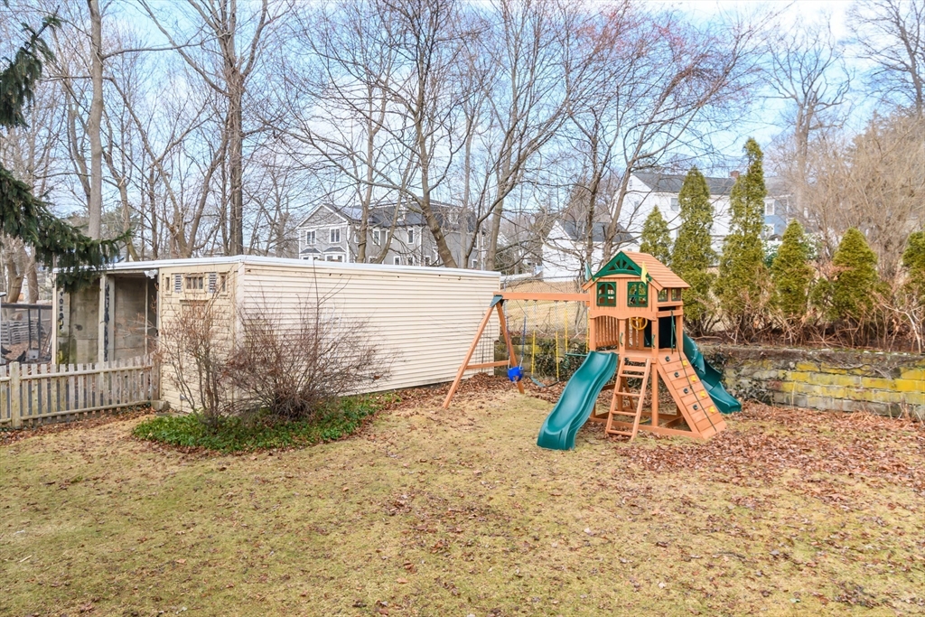 32 Harvard Street Natick, MA 01760 - Photo 22 of 24 a view of outdoor space with swimming pool and slide