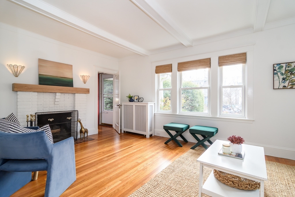 32 Harvard Street Natick, MA 01760 - Photo 4 of 24 a living room with furniture and a fireplace